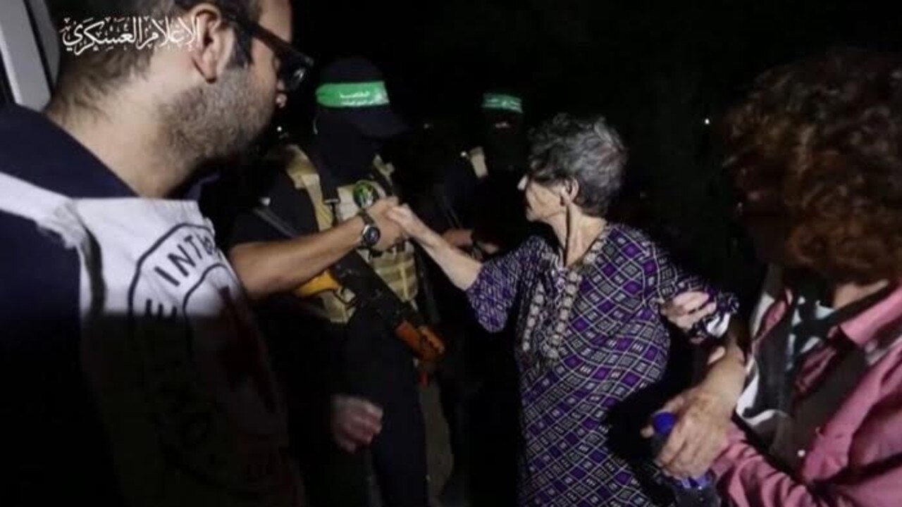 Freed hostage Yocheved Lifshitz shakes hand with her captor. Picture: BBC