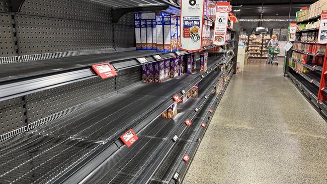 Empty shelving in Woolworths at Camberwell, Melbourne. Picture: Alex Coppel