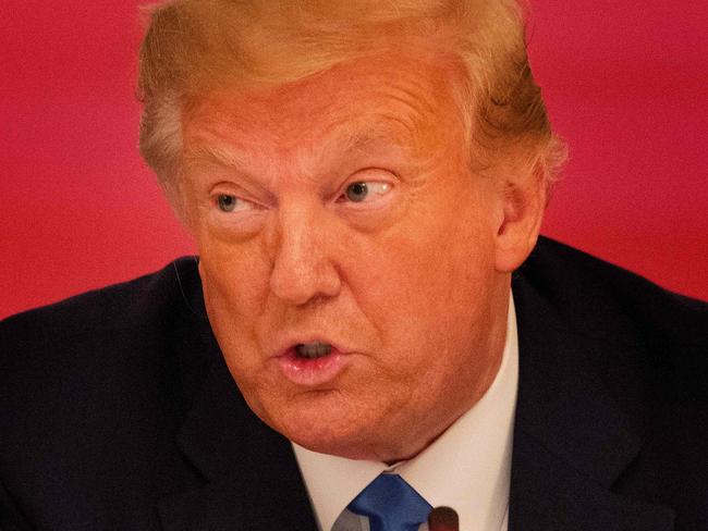 US President Donald Trump participates in a roundtable with stakeholders positively impacted by law enforcement, in the East Room of the White House in Washington, DC, on July 13, 2020. (Photo by JIM WATSON / AFP)