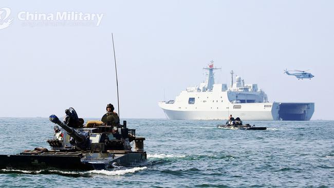 Amphibious armoured vehicles attached to a brigade of the PLA Navy Marine Corps make their way to the beachhead during a maritime amphibious assault training in Guangdong Province. Picture: PLA.