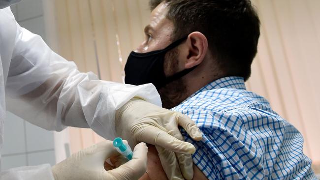 A nurse inoculates a volunteer with Russia's new Sputnik V coronavirus vaccine. Picture: AFP