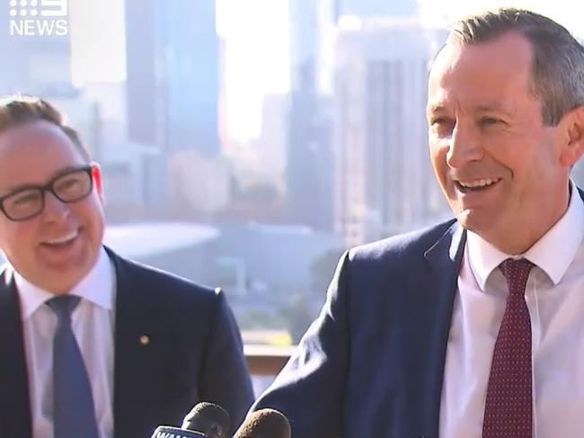 Mark McGowan and Alan Joyce have laugh during a press conference in Perth.