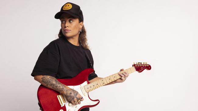 Australian singer, songwriter and guitarist Tash Sultana, pictured with a signature Tash Sultana Stratocaster, ahead of a global campaign to celebrate the 70th anniversary of the iconic Fender Stratocaster electric guitar in 2024. Picture: Alysse Gafkjen