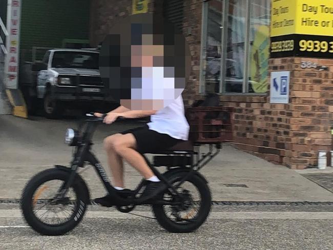 A secondary school student on an e-bike on Pittwater Rd, Manly. Picture: Jim O'Rourke