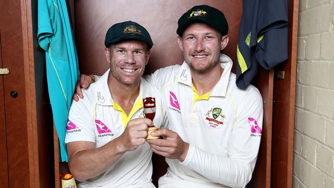 Happier times: David Warner and Cameron Bancroft celebrate with the Ashes Urn in the change rooms after the Fifth Test of the 2017/18 Ashes Series. Picture: Ryan Pierse/Getty Images