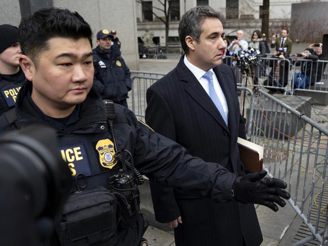 In this Dec. 12, 2018, photo, Michael Cohen, President Donald Trump's former lawyer, leaves federal court after his sentencing in New York. Trump has gone from denying knowledge of any payments to women who claim to have been mistresses to apparent acknowledgement of those hush money settlements â€“ though he claims they wouldn't be illegal.  (AP Photo/Craig Ruttle)