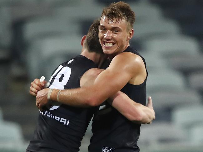 Patrick Cripps of the Blues embraces Sam Walsh of the Blues after a win during the Round 3 AFL match between the Geelong Cats and the Carlton Blues at GMHBA Stadium in Melbourne, Saturday, June 20, 2020. (AAP Image/Dylan Burns) NO ARCHIVING, EDITORIAL USE ONLY