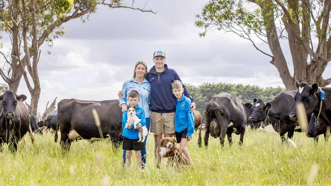 Ryan and Alysha Conlan with their two kids 9yo James and 7yo Lewis, Floppy the Jack Russell terrier and Rip the Border Collie on farm at Elingamite Picture: Zoe Phillips