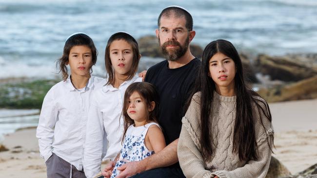 Jewish man Marc Rosenthal and his four children Gali, 11, Amichai 10, Aviel, 8 and Nili, 4 at Bondi Beach. Picture: David Swift.