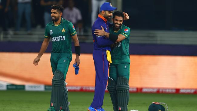 Virat Kohli, centre, congratulates Pakistan captain Mohammad Rizwan for his win last week in Dubai. Picture: Getty Images