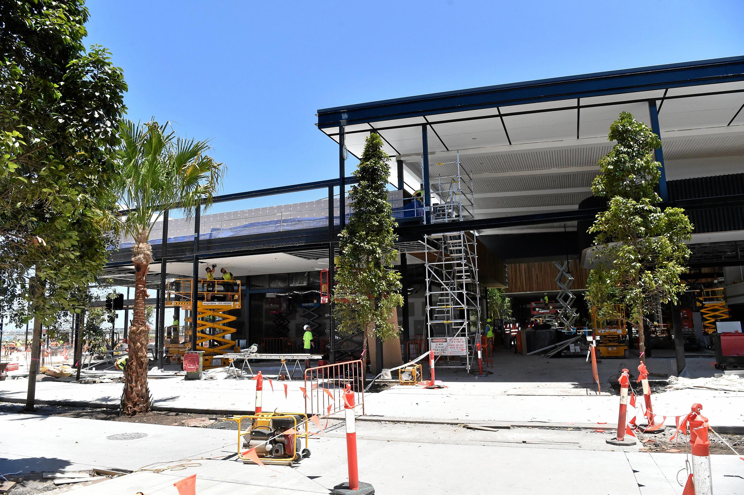 Full steam ahead for the opening of the Stockland Birtinya Shopping Centre. Constuction workers put the final pieces together for the grand opening in a couple of weeks. Picture: Warren Lynam