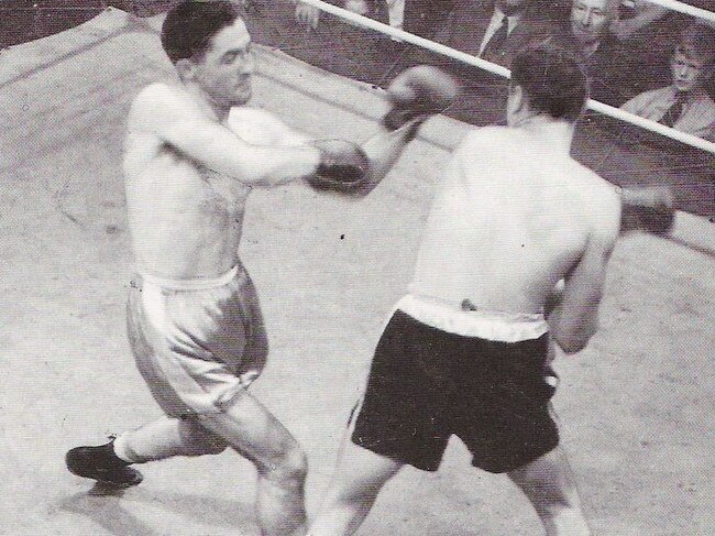 Vic Patrick (left) taking on Tommy Burns.