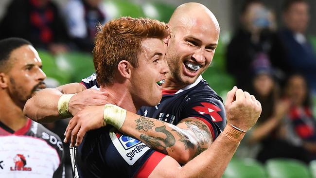 Rebels player Andrew Kellaway (L) celebrates with teammate Bill Meakes (R) after scoring a try during the Super Rugby match between Australia's Rebels and South Africa's Lions in Melbourne on March 7, 2020. (Photo by William WEST / AFP) / -- IMAGE RESTRICTED TO EDITORIAL USE - STRICTLY NO COMMERCIAL USE --