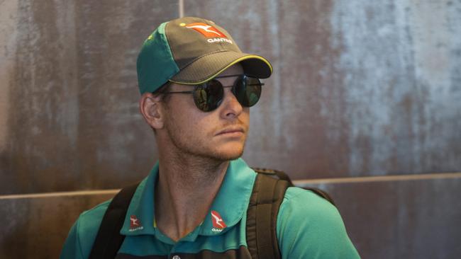 Steve Smith arrives with teammates at the Cape Town International airport.