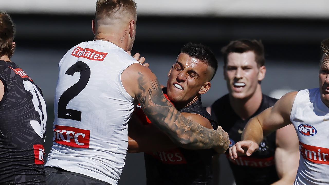 Nick Daicos attempts to push off Jordan De Goey. Picture: Michael Klein