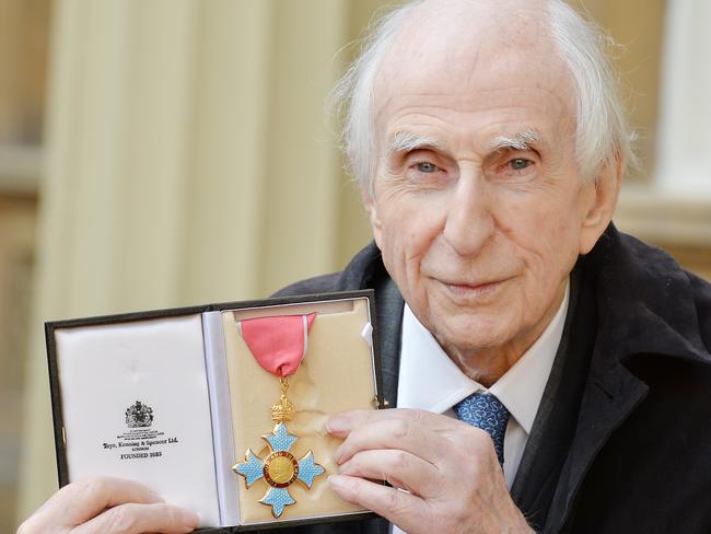 Paddington Bear creator Michael Bond holds his Commander of the Order of the British Empire (CBE) award after it was presented to him by the Duke of Cambridge at an Investiture ceremony at Buckingham Palace on October 27, 2015 in London.  Picture:  Getty