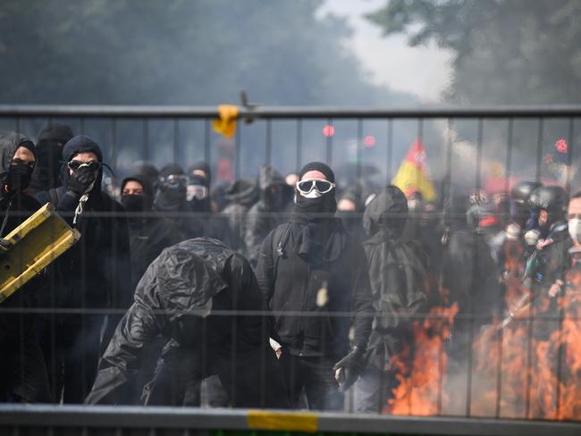 Protesters wear masks as thousands of people take to the streets during the May Day demonstrations on May 1. Picture: Jeff J Mitchell/Getty Images