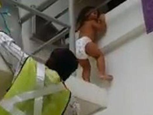 This man will receive a recognition award in Singapore after saving this dangling toddler.