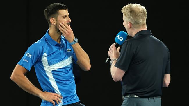 Novak Djokovic is interviewed by Jim Courier on day 10 of the Australian Open. Picture: Getty Images