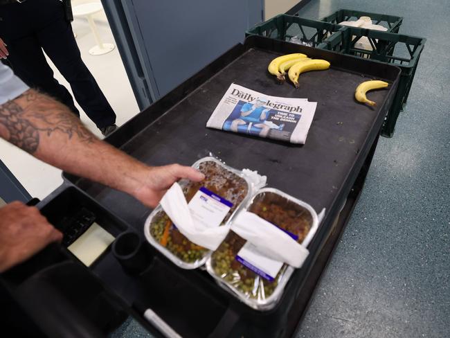 Dinner, Supermax-style: Beef, peas, bananas and a copy of The Daily Telegraph. Picture: News Corp