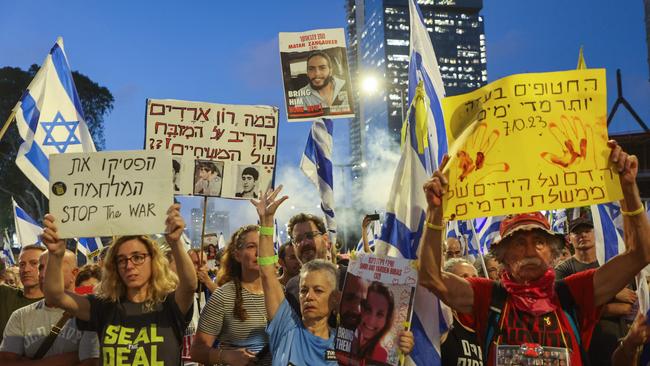 Protesters lift placards and flags as they rally to call for the release of Israelis held hostage by Palestinian militants in Gaza since the October attacks in the central city of Tel Aviv on July 7. Picture: Gil Cohen-Magen/AFP