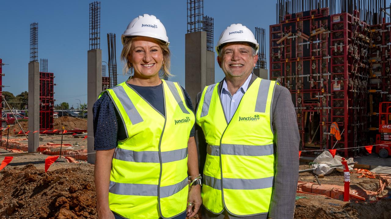 Junction chief executive Maria Palumbo and chair Rob DiMonte at Junction's $37m affordable apartment development under construction at Tonsley. Picture: Sarah Reed