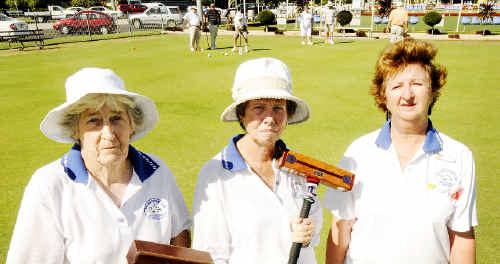 Ballina Croquet Club members (front, from left) Lorraine Whiteman, club captain of golf croquet; Jean Hill, coach of the golf croquet; and club president Mary Hughes stand united yesterday as members of the new Ballina Cherry Street Croquet Club play in the background. Picture: DOUG EATON