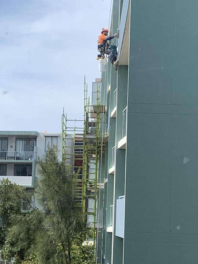 Works being done to fix defects at a Toplace apartment complex in Botany.