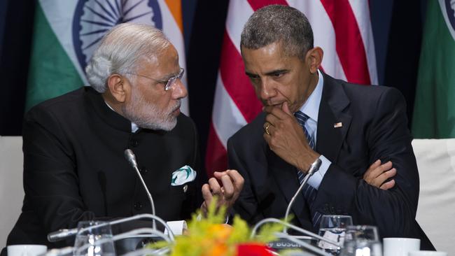 Indian PM Narendra Modi speaks to US President Barack Obama in Paris on Monday. Picture: AP