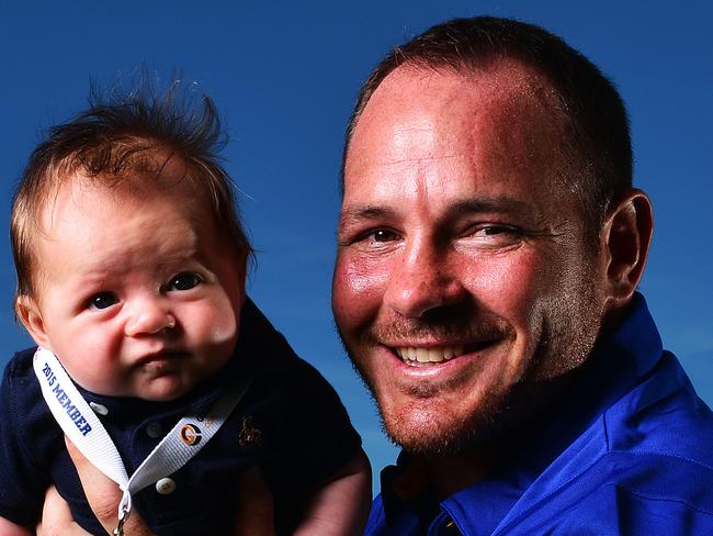 Cowboys co-captain Matthew Scott with 3 month old son Hugo who today was announced as the Cowboys 10,000th member for 2015. Picture: Zak Simmonds