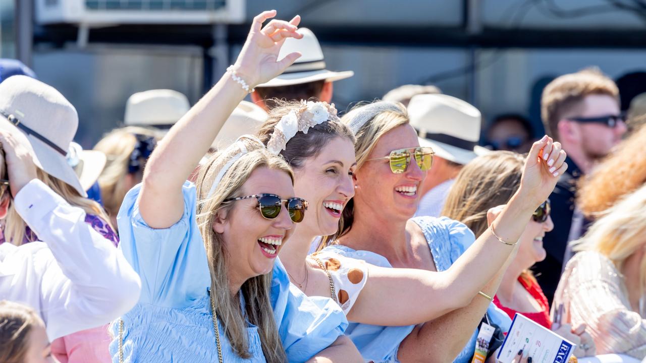 Willow Frey, Jane Bradby and Kelly Wood cheer on their horse at Magic Millions. Picture: Luke Marsden.