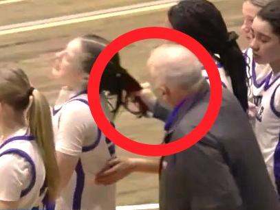 Coach Zullo continues berating Monroe after he yanked her hair. Photo: News10/NFHS Network.