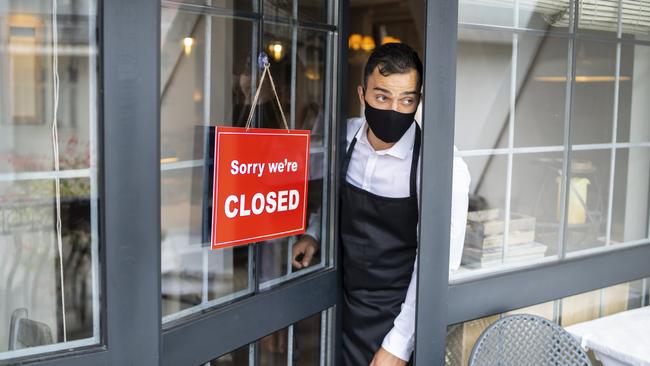 Businesses were forced to close as hospitality sector profits, along with financial services and transport, dropped about 13 per cent during the quarter. Picture: Getty Images