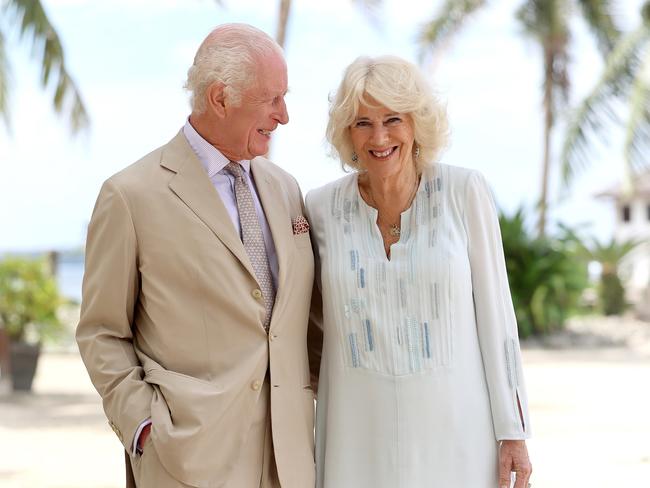 King Charles III with Queen Camilla during a visit to a beach in Apia, Samoa, last month. The monarch is also under fire over money being made from rental properties. Picture: Getty Images