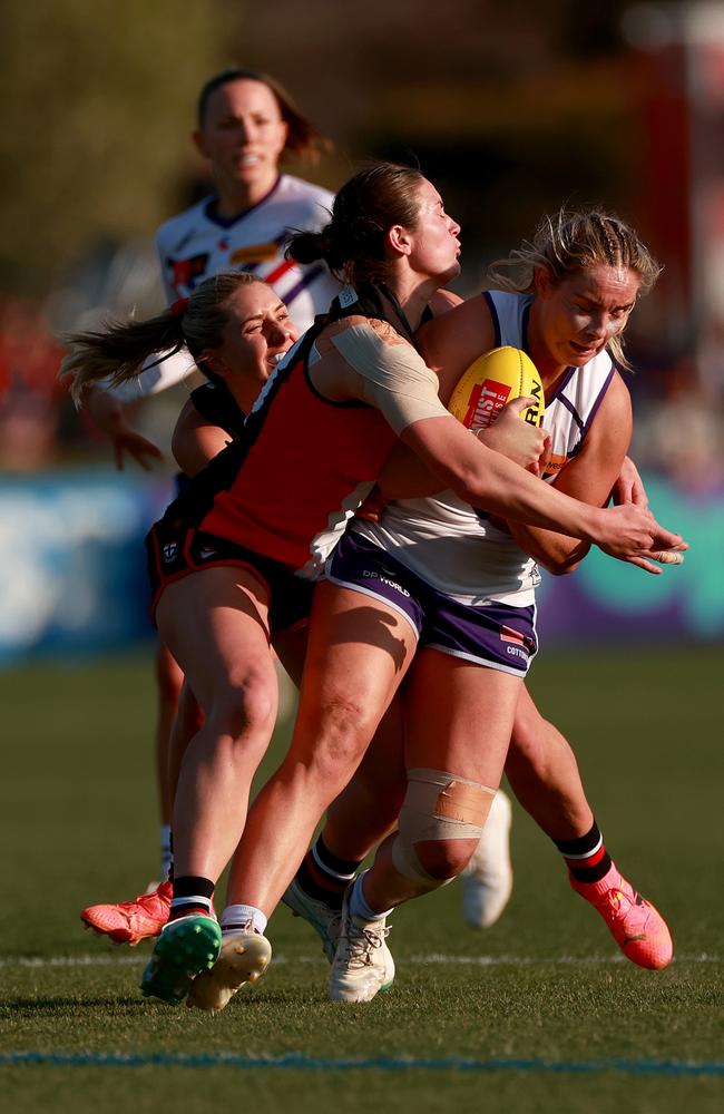 Aisling McCarthy of the Dockers is tackled by Charlotte Simpson of the Saints. Picture: Kelly Defina/Getty Images.