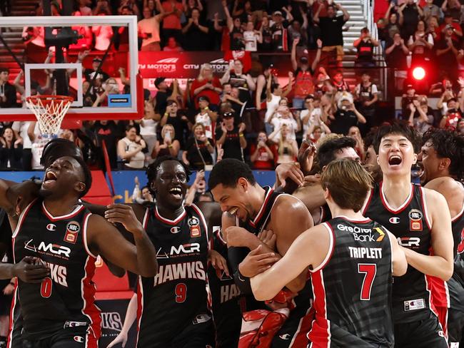 Illawarra Hawks celebrate their win after game five of the 2024/25 NBL Grand Final series, which clinched the title. Picture: Darrian Traynor/Getty Images