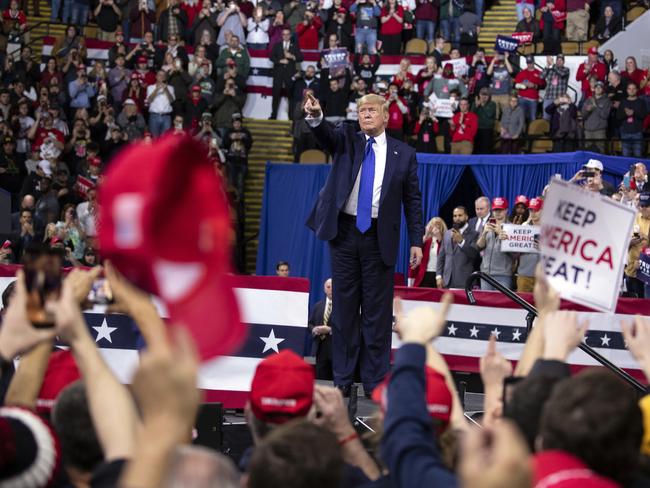 US President Donald Trump points to the crowd after speaking during a campaign rally at UW-Milwaukee Panther Arena, Picture: AP