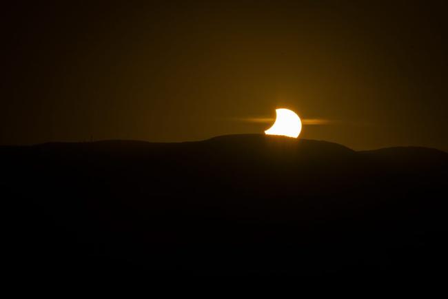 The partial solar eclipse on April 29, 2014, photographed from Auckland Point, Gladstone. . Picture: Luka Kauzlaric