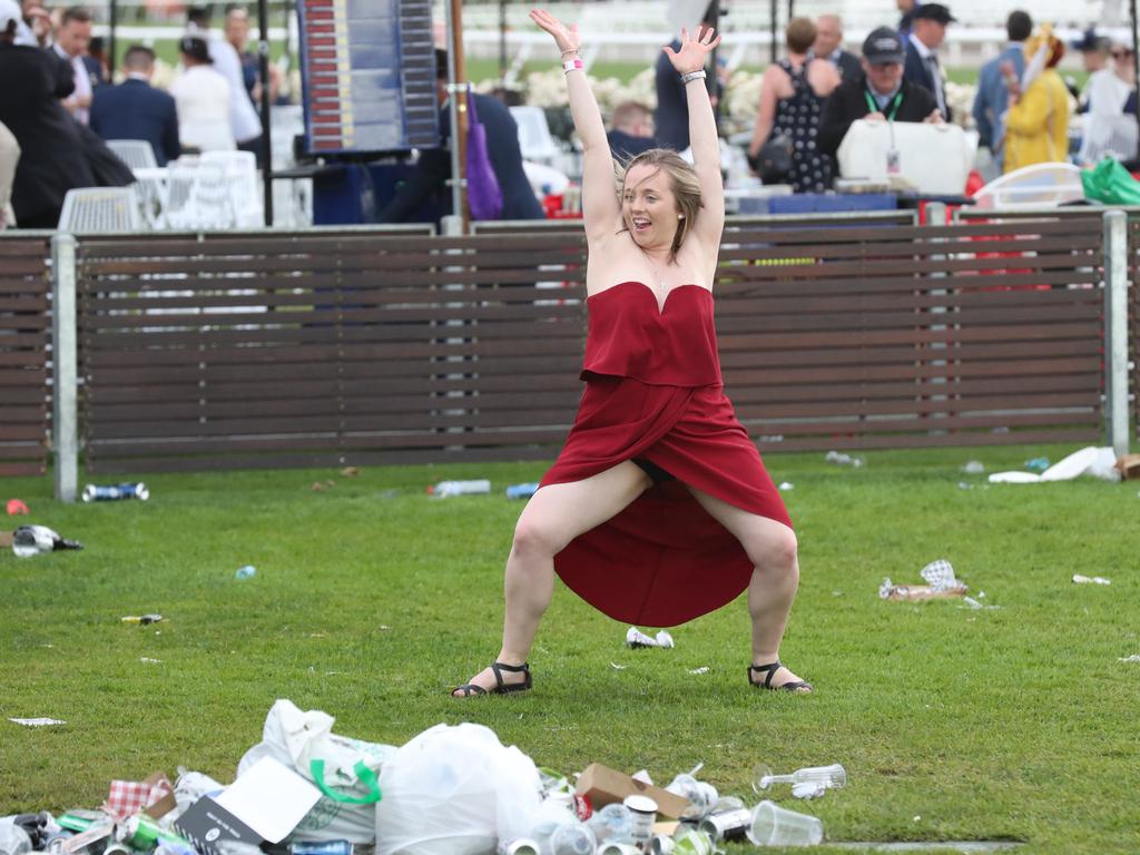 Racegoers are seen at the end of the Lexus Melbourne Cup Day, as part of the Melbourne Cup Carnival, at Flemington Racecourse in Melbourne, Tuesday, November 6, 2018. (AAP Image/Dave Crosling) NO ARCHIVING, EDITORIAL USE ONLY