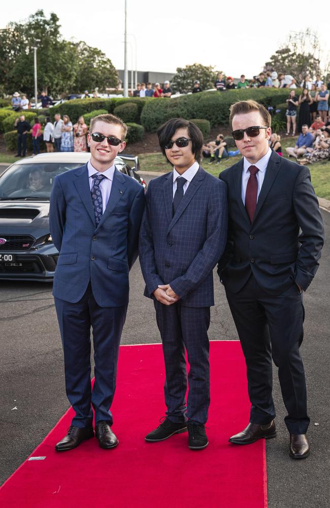 Graduates (from left) Matthew Kruger, Dylan Verches and Jack Franzmann arrive at Mary MacKillop Catholic College formal at Highfields Cultural Centre, Thursday, November 14, 2024. Picture: Kevin Farmer