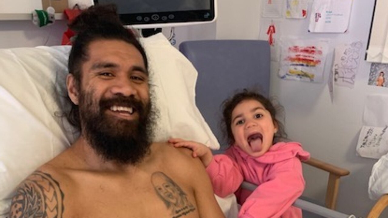 Mose Masoe in hospital with daughter Marlow.