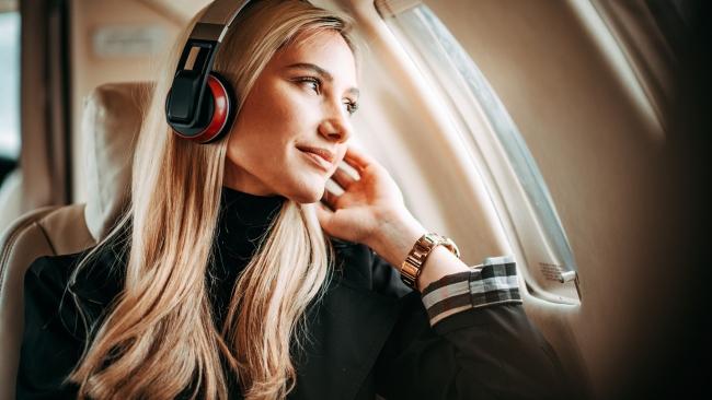 Don't forget the cord and adaptor for your headphones if you want to use with the in-flight entertainment system. Picture: Getty