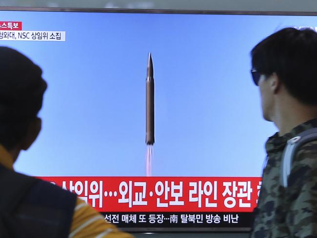 People watch a TV screen at the Seoul Railway Station in South Korea after North Korea fired a ballistic missile from its capital Pyongyang that flew over Japan. Picture: AP