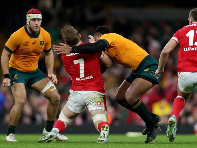 CARDIFF, WALES - NOVEMBER 17: Jac Morgan of Wales is tackled by Samu Kerevi of Australia, which is later concluded as a high tackle following a TMO Review resulting in a yellow card before being escalated to a 20 Minute Red Card following the conclusion of the Bunker Review, duringthe Autumn Nations Series 2024 match between Wales and Australia at the Principality Stadium on November 17, 2024 in Cardiff, Wales. (Photo by David Rogers/Getty Images)