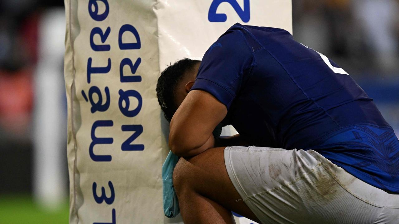 Samoa’s hooker Sama Malolo reacts at the end. (Photo by Miguel MEDINA / AFP)