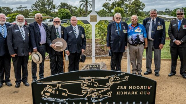 Veterans stand in acknowledgement of those who served and sacrificed for their country at the newly erected Long Tan Cross at the opening of the Veterans’ Memorial Park in Murgon. Photo: Gerkies Photography.