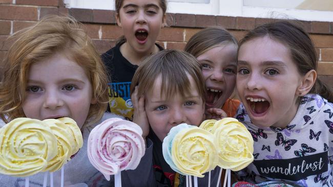 Caitlin Dunstan, Emily Dunstan,, Cooper Gibson, Allegra Gibson and Charlotte Raven enjoy the cake stall at Panania Public School. Picture: Matthew Vasilescu