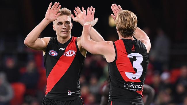 Matt Guelfi celebrates a goal with Darcy Parish.