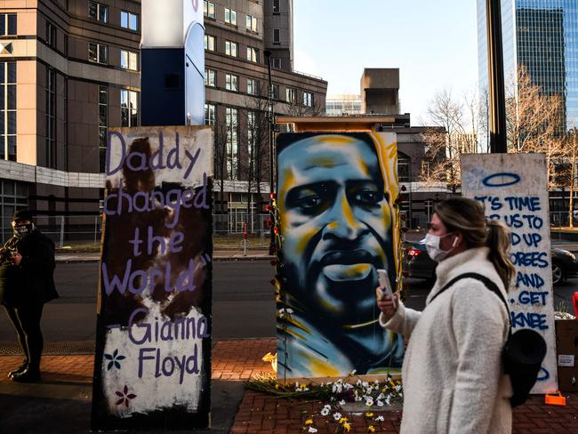 A painting of George Floyd is kept outside the Hennepin County Government Center before jury selection begins at the trial of former Minneapolis Police officer Derek Chauvin. Picture: AFP