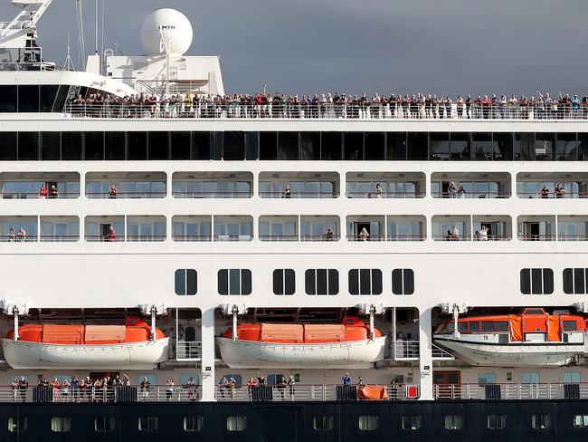 Passengers are seen on the Vasco da Gama cruise ship as it arrives into Fremantle harbour in Fremantle on Friday, March 27, 2020. The Vasco da Gama has about 800 Australians onboard, including 200 passengers from WA. There are also foreign nationals onboard, including 108 New Zealanders who will fly home on Saturday night. (AAP Image/Richard Wainwright) NO ARCHIVING